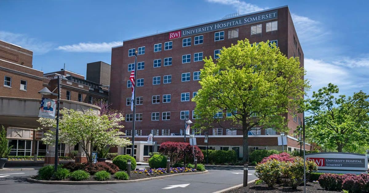 RWJ University Hospital Somerset, a brick tower with spring trees
